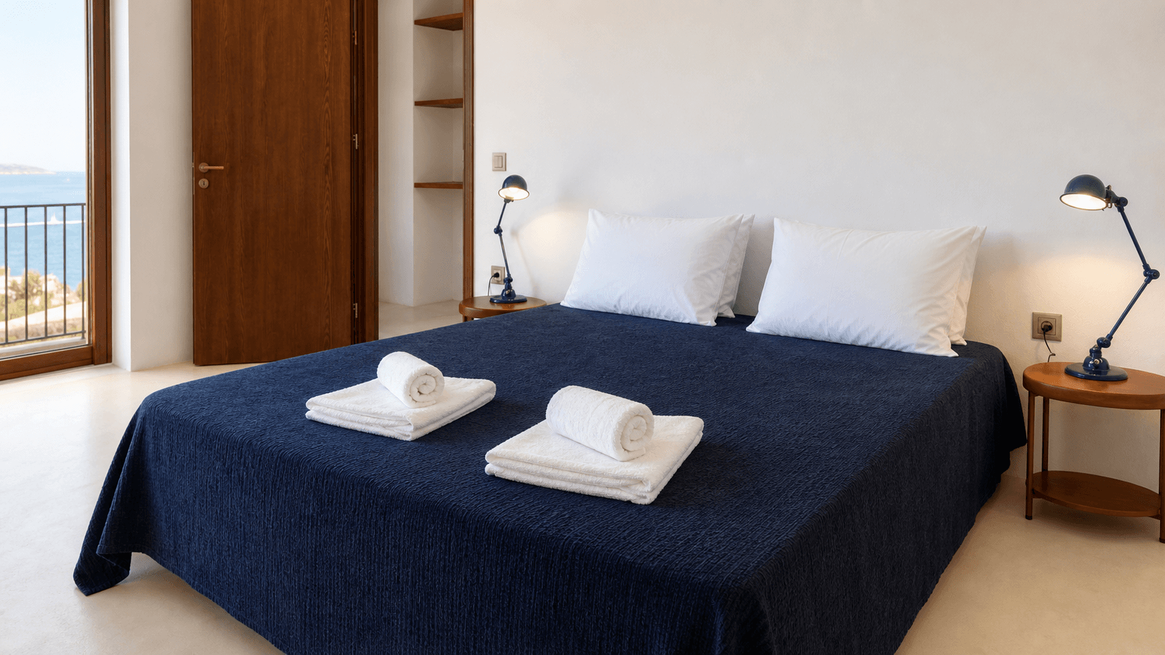 Fresh towels and bed details in a guest room at The Grand Forgetmenot 2