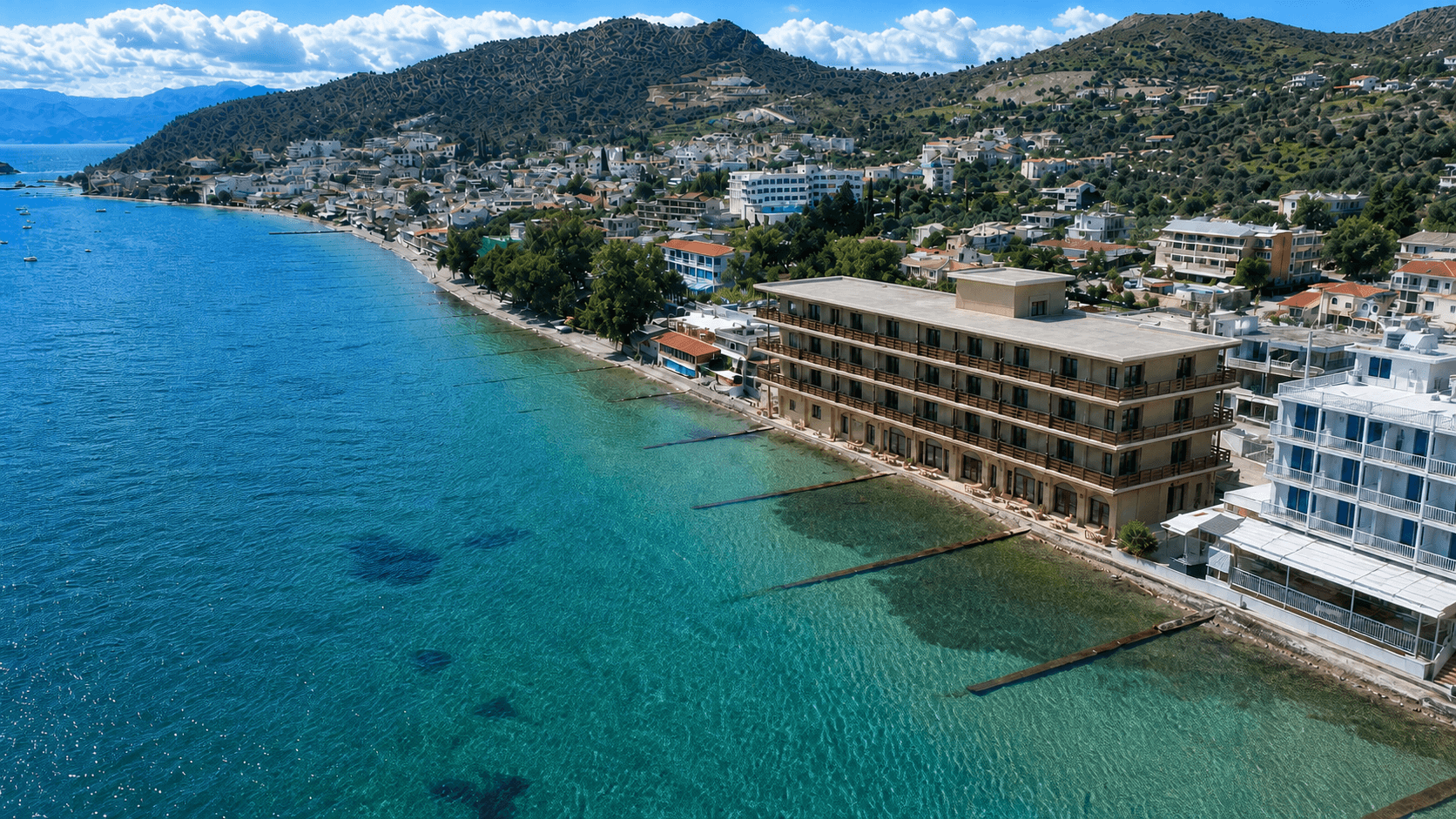 Aerial view of the waterfront hotel on Tolo Bay