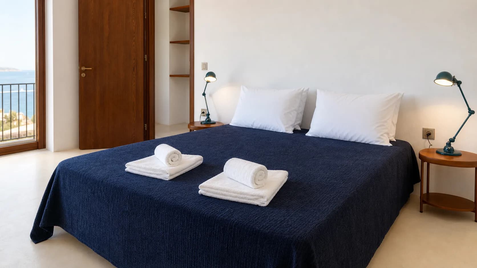 Fresh towels and guest-room bed detail